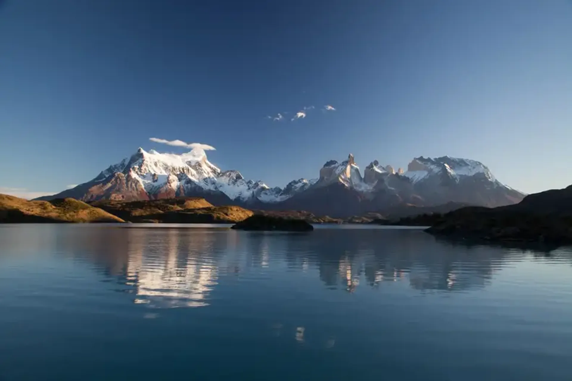 snow covered mountain in reflective photography